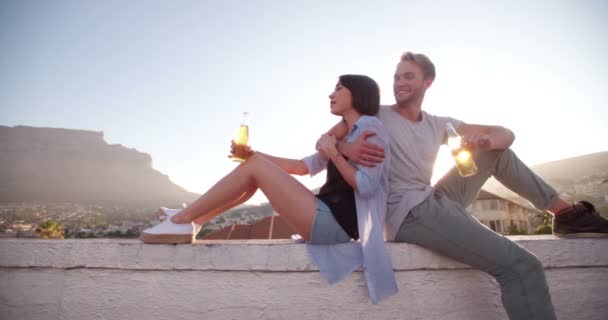 Hipster couple enjoy a beer on the rooftop — Stock Video