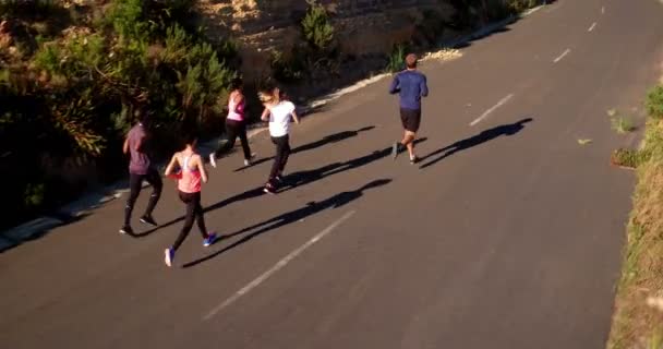 Team of athletes running outdoors on summer — Stock Video