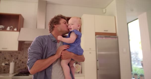 Dad Holding and Kissing Infant Daughter on Cheek — Stock Video