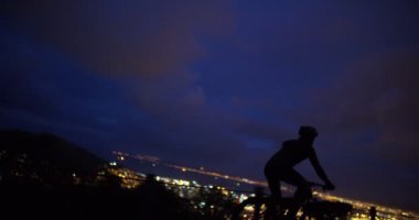 unrecognizable cyclist riding his bicycle