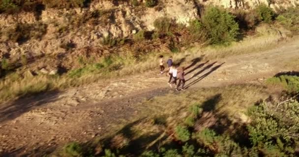 Cheerful friends running outdoors — Stock Video