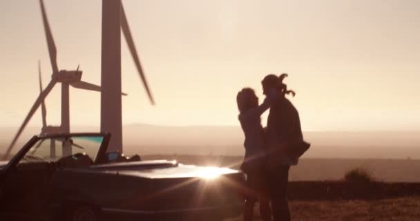 Lovers hugging on road trip at sunset — Stock Video