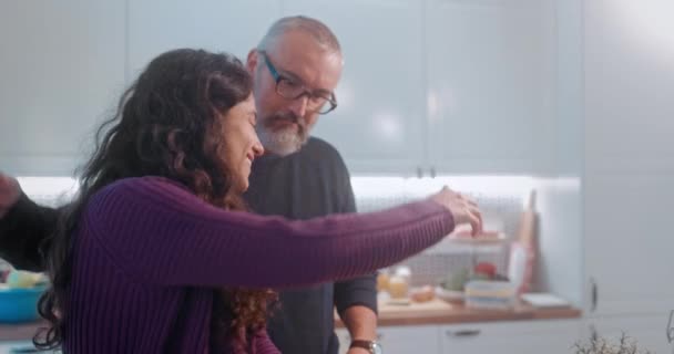 Senior father hugging daughter at home in the kitchen — Stock Video