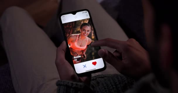 Man using mobile phone dating app at home Video Clip
