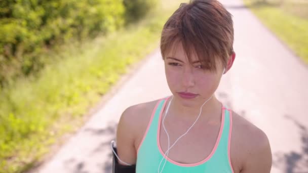 Runner Listening to Music — Stock Video