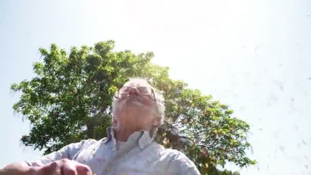 Older man enjoying Confetti — Stock Video