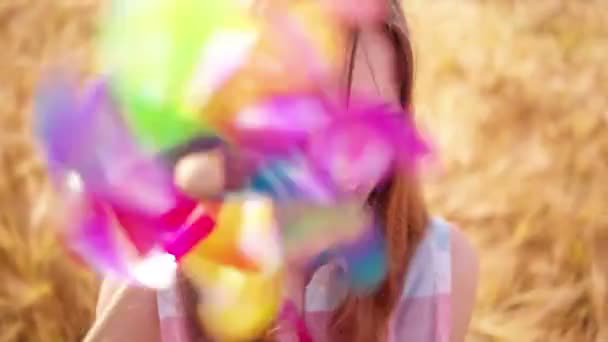 Young Girl Playing With Pinwheel — Stock Video