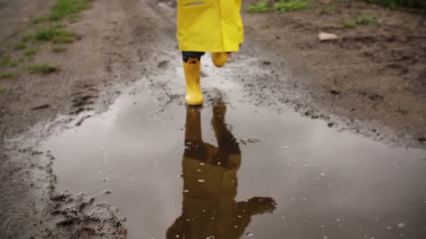 Young Boy Running Through Puddle — Stock Video