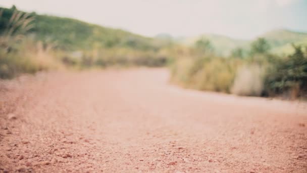 Gravel road in desert landscape — Stock Video