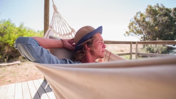 Teen guy resting in a hammock — Stock Video