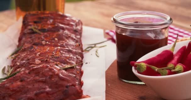 Succulent rack of ribs on a wooden table — Stock Video