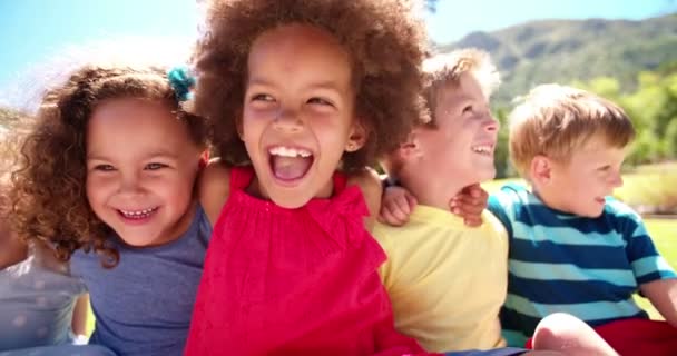 Mixed racial group of friendly children laughing — Stock Video