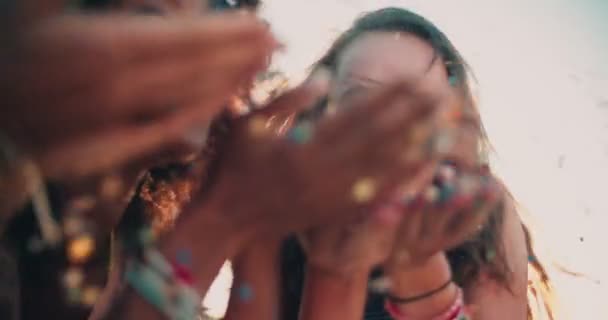 Teenage girls blowing confetti — Stock Video