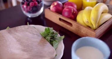 Fresh fruit in bowls laid out for a healthy breakfast