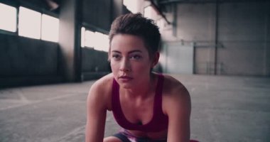 woman warming up for exercise by stretching