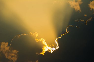 Sun shines through the clouds and the sky shines in light