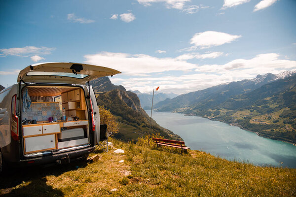 Vanlife - Camping Van on a mountain in Switzerland