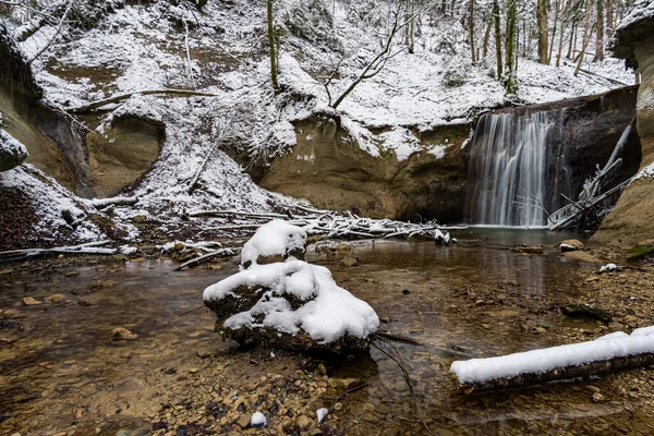 Hike through the snow-covered ravine at Schmalegg near Ravensburg in Upper Swabia