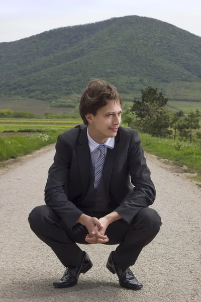 Businessman on the road — Stock Photo, Image