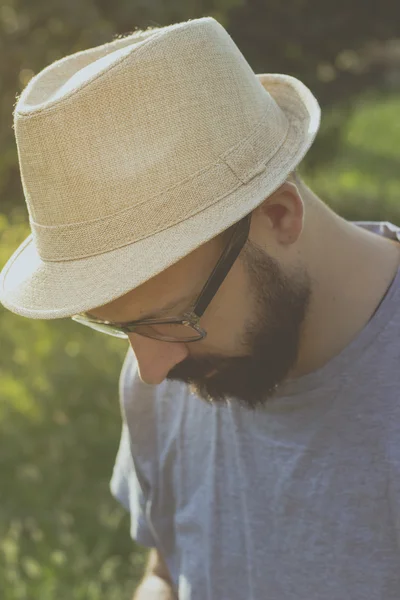 Bearded young hipster man daydreaming — Stock Photo, Image