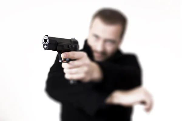 Gunmen aiming with a handgun — Stock Photo, Image