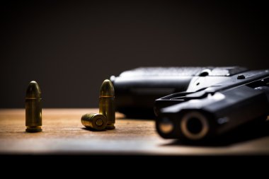 Handgun and bullets clipart