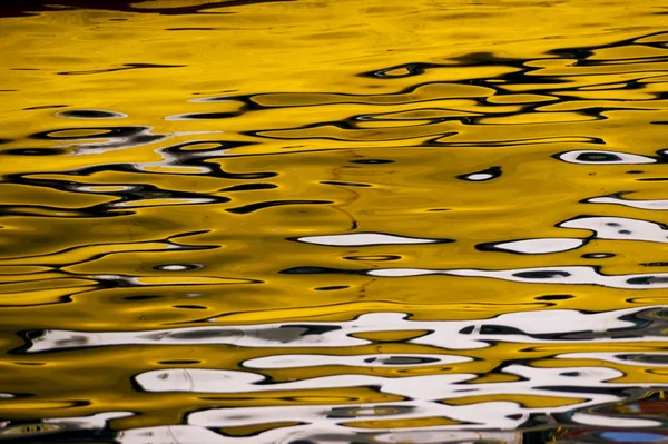 Yellow reflections on the water. — Stock Photo, Image