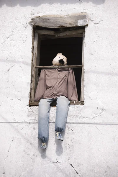 Scarecrow on a window. — Stock Photo, Image