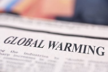 Küresel ısınma yazılı gazete metne yakın çekim.