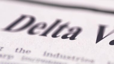 Delta varyantı yazılı gazetenin görüntüsü metne yakın çekim.