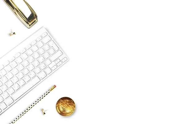 Flat lay, office white desk and keyboard with gold stationery. Gold stapler, stripe gold pattern, pencil. Floral tulip. View top. Table up. Mock-up background — Stock Photo, Image