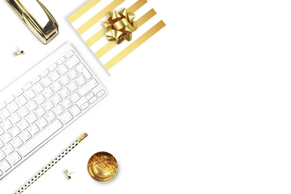 Flat lay, office white desk and keyboard with gold stationery. Gold stapler, stripe gold pattern, pencil. View top. Table up. Mock-up background — Stock Photo, Image