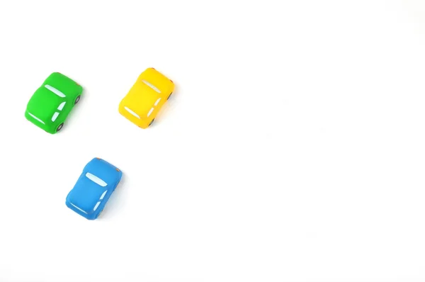 Colorful cars | Yellow, Blue, Green | White desktop | Toys style | — Stock fotografie