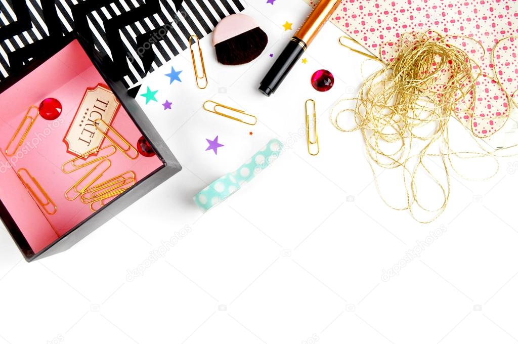 Elegant background. Pattern gold polka dots, and gold clip. Flat lay. Workspace with stationery. Mock-up background.