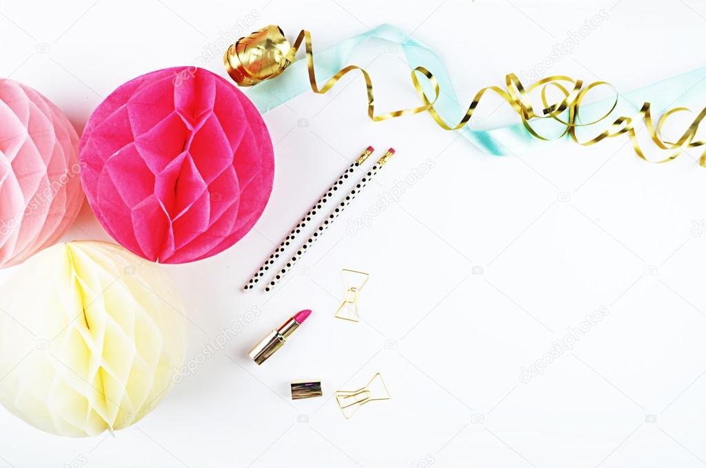 party paper ball, and gold woman accessories. white background