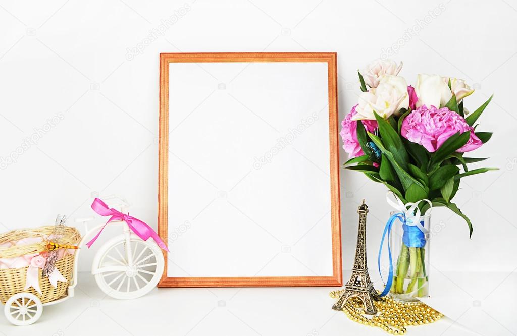 Frame mockup, peonies in vase and gold accessories, white backgorund