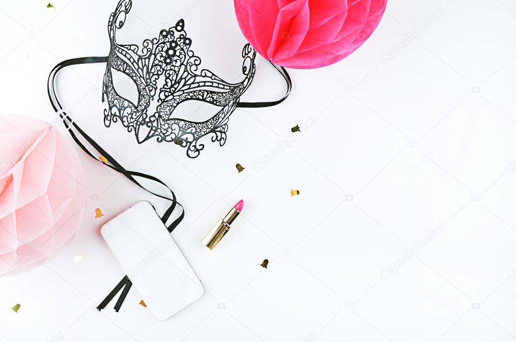 feminine desk, mask and balls. party style