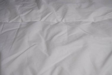 Beyaz battaniye. Çarşaf. Yatağa. İç mekan. Doku. Arkaplan