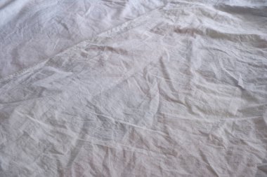 Beyaz battaniye. Çarşaf. Yatağa. İç mekan. Doku. Arkaplan