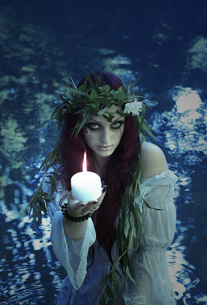 Fabulous girl, Lady Lake, Mavka wreath of willow and flowers with a candle