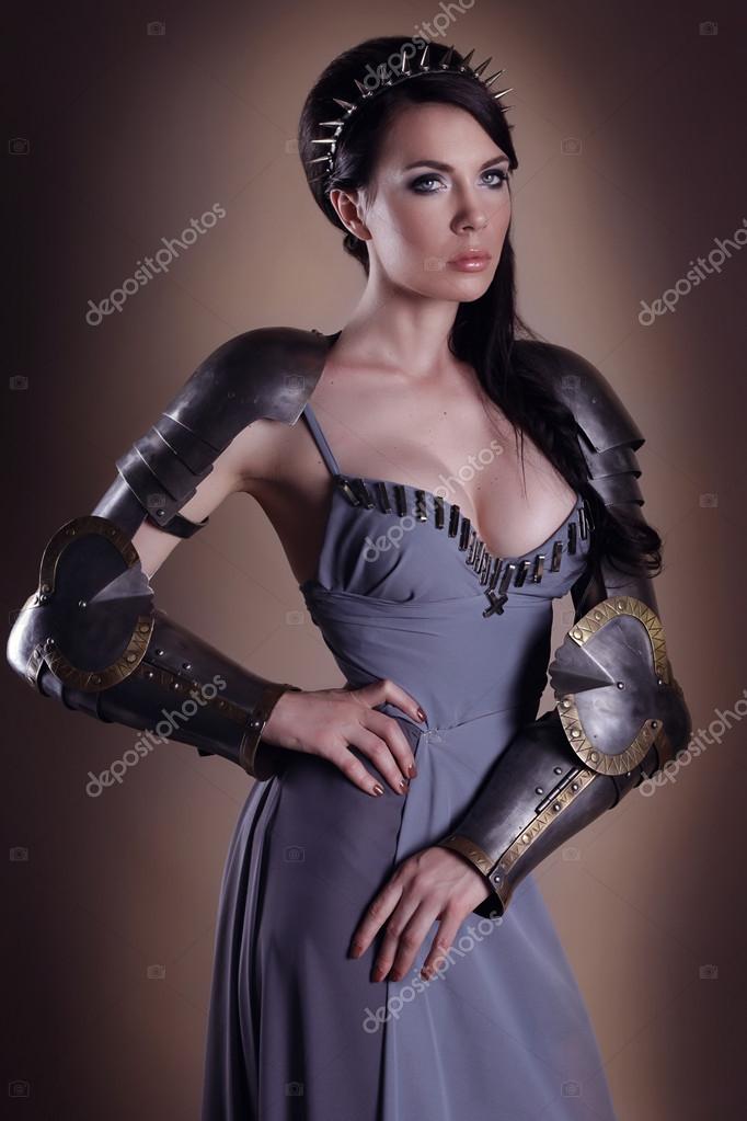 Portrait of a beautiful lady warrior, dark-haired girl in a gray Stock  Photo by ©Selenittt 63001041