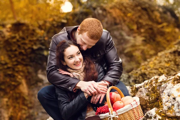 Happy young couple in love meeting on the autumn leaf — Stock Photo, Image