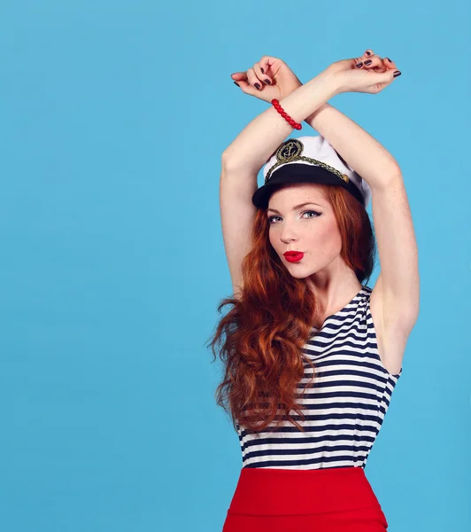 Adorable model wearing sea admirals hat and sexy top