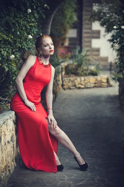 Young sexy womanl in red dress. beauty shot — Zdjęcie stockowe