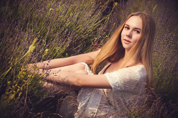 Beautiful provence woman relaxing in lavender field watching on sunset. Series. alluring girl with purple lavender. — Stock Photo, Image