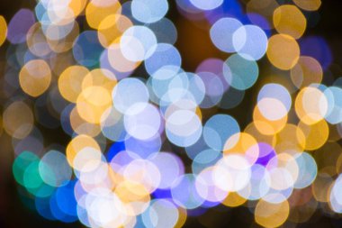 Renkli soyut bokeh arkaplanı. Geceleri kış süslemeleri..