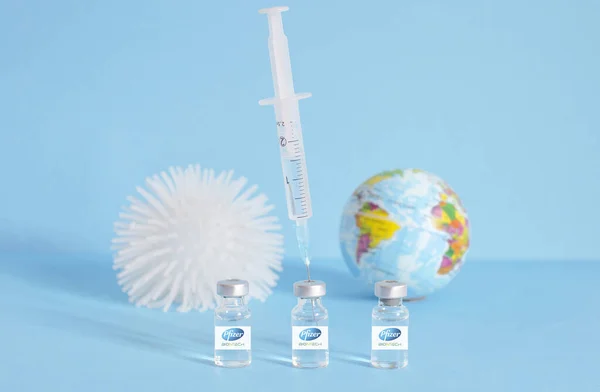 Graz, Austria-26.01.2021: Worldwide pandemic vaccination with the Pfizer-BioNTech COVID-19 vaccine, beginning of mass vaccination for coronavirus, world immunization conceptual photo.