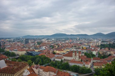 Cityscape of Graz with Mur river and Mariahilfer church (Mariahilferkirche), view from the Shlossberg hill, in Graz, Styria region, Austria