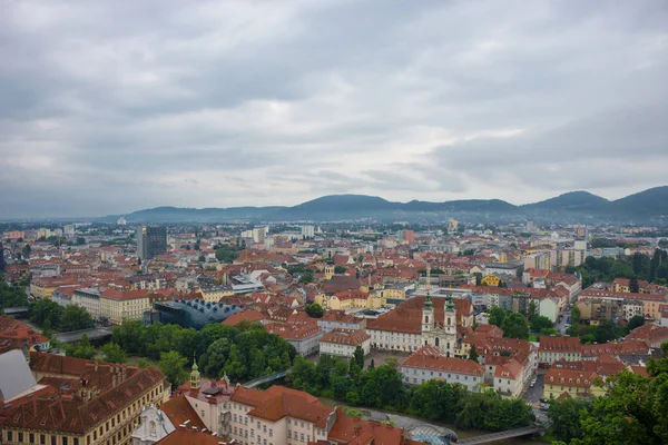 Cityscape of Graz with Mur river and Mariahilfer church (Mariahilferkirche), view from the Shlossberg hill, in Graz, Styria region, Austria