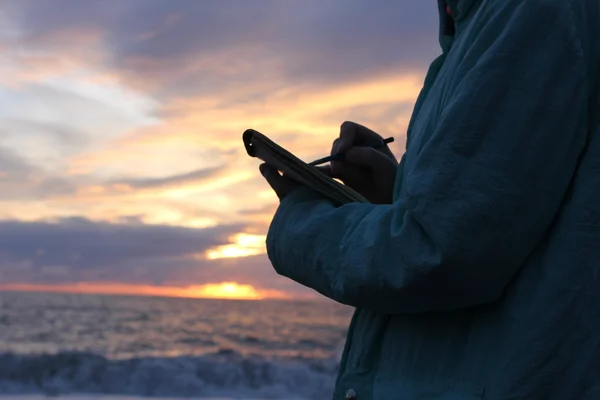 Drawing on the waterfront in sunset — Stock Photo, Image